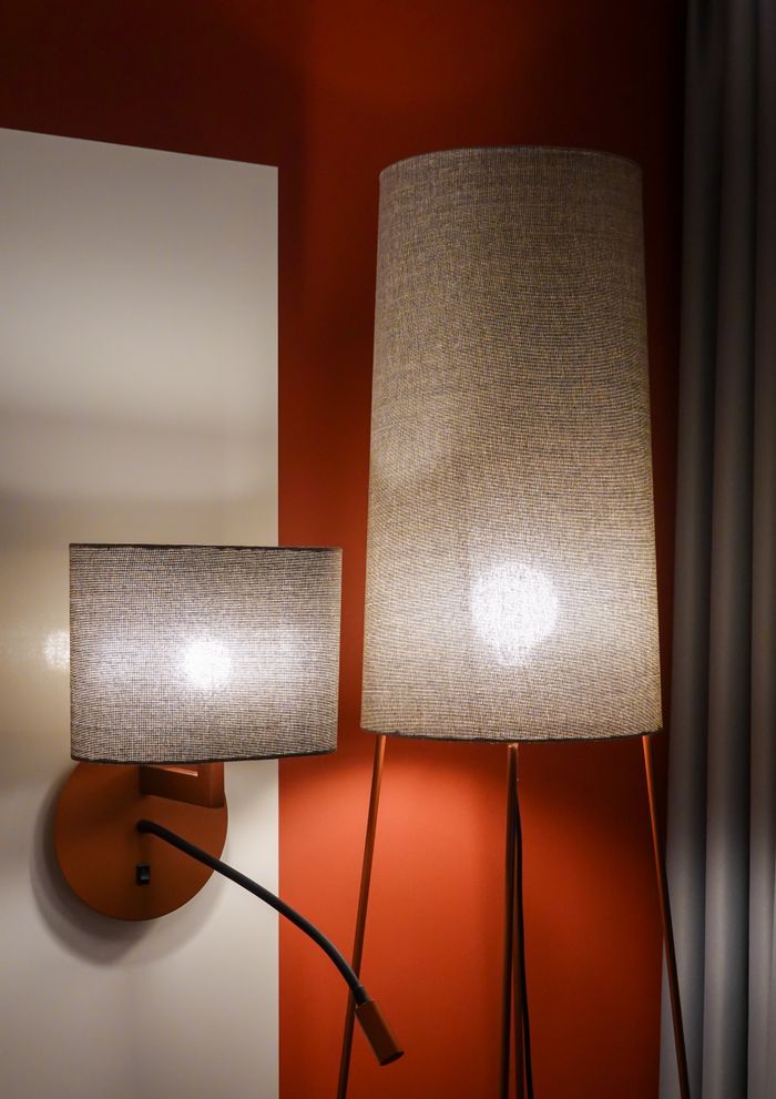 Elegant designer lamps in a contemporary hotel room interior, showcasing modern light fixtures.